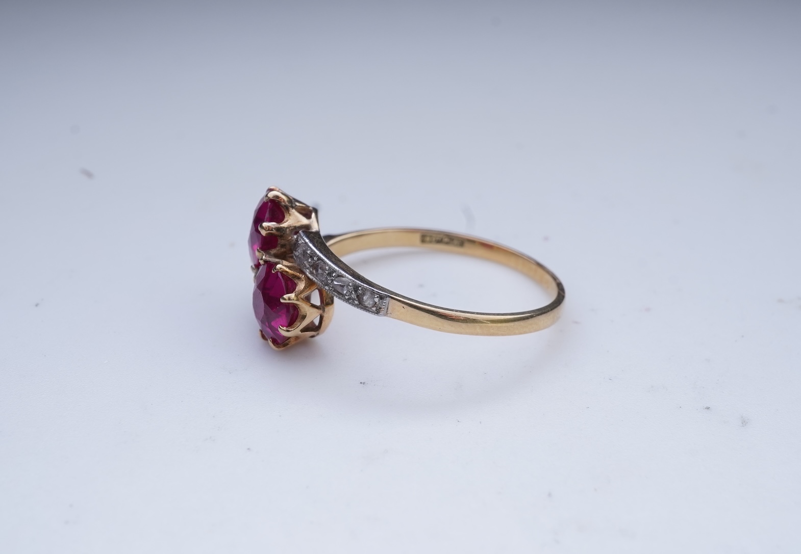 A synthetic ruby and diamond 'toi-et-moi' ring, early 20th century